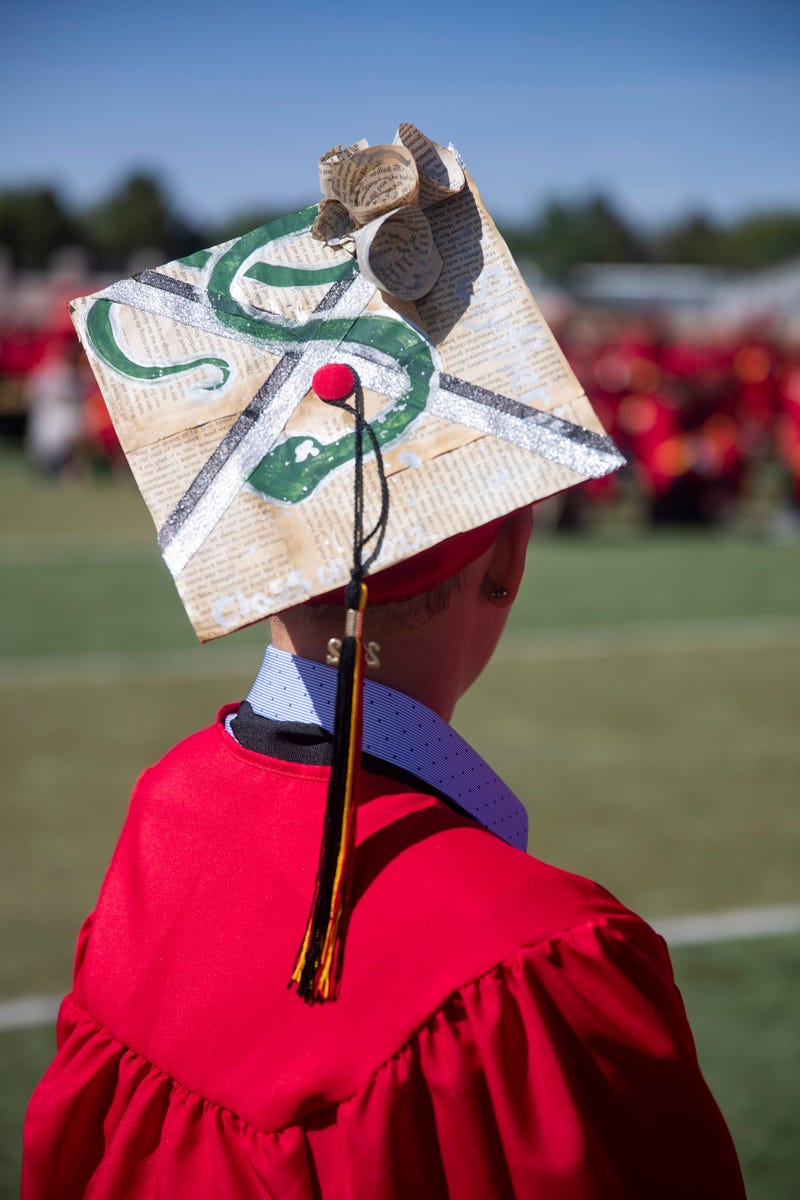 Centennial High School senior Ivory Crow's Hogwarts-inspired cap featuring a snake during the Centennial High School graduation ceremony at the Field of Dreams in Las Cruces, New Mexico on May 20, 2022. A recent survey found that New Mexico's Hogwarts house is, in fact, Slytherin. 