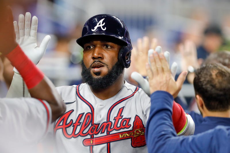 May 20, 2022; Miami, Florida, USA; Atlanta Braves left fielder Marcell Ozuna (20) celebrates with teammates after hitting a home run during the first inning against the Miami Marlins at loanDepot Park.