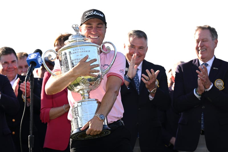 Justin Thomas hugging trophy at PGA Championship