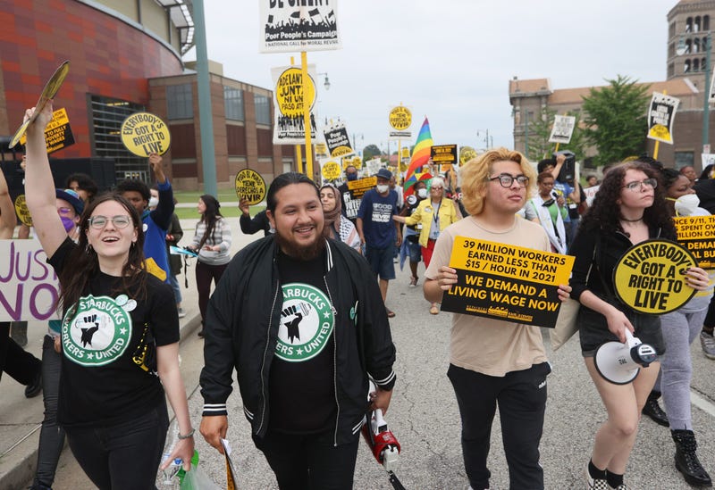 Members of the Memphis 7, a group of Starbucks employees that were fired after seeking to form a union at their store, march through the streets of Downtown Memphis on Monday, May 23, 2022.
