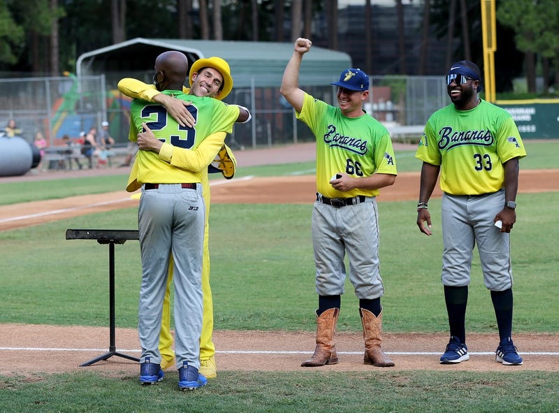Savannah Bananas owner Jesse Cole hugs Reggie Horton as the team celebrates last year's Coastal Plains League Championship.