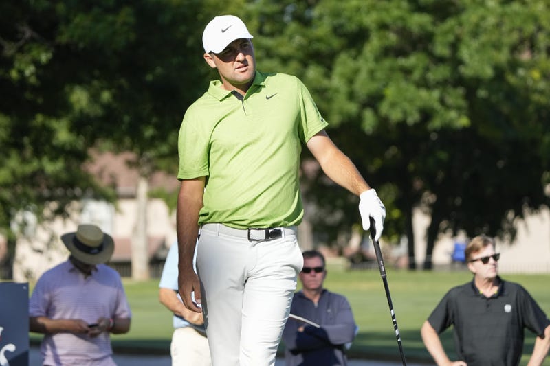 Scottie Scheffler watches his tee on the 11th hole during the first round of the Charles Schwab Challenge