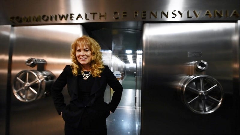 Stacy Garrity, Pennsylvania Treasurer, stands outside the 60-ton door of the 1939 York Safe & Lock Co. built safe in Harrisburg. 