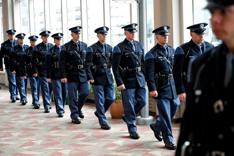 Michigan State Police recruits walk into their graduation ceremony at the Lansing Center on Friday, May 27, 2022, in downtown Lansing. The graduates of MSP's 141st Trooper Recruit School are the first ever candidates to join the force already serving as law enforcement officers.