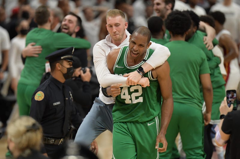 Boston Celtics center Al Horford (42) and forward Sam Hauser (30) celebrate after the Celtics beat the Miami Heat in game seven of the 2022 eastern conference finals at FTX Arena