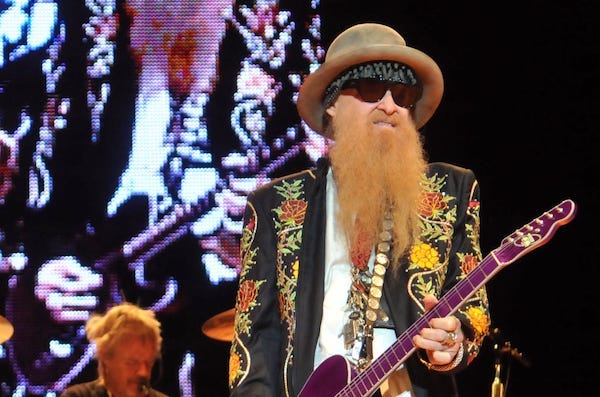 ZZ Top front man, Billy Gibbons, jams during a performance 