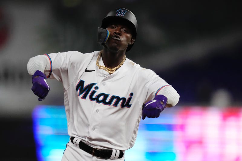 Miami Marlins second baseman Jazz Chisholm Jr. (2) rounds the bases and flexes after connecting for a grand slam home run