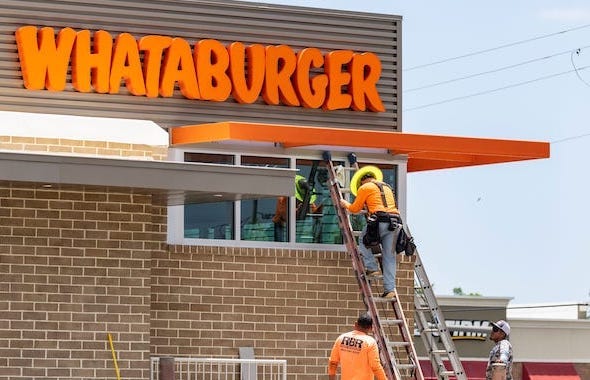 Construction workers building new Whataburger