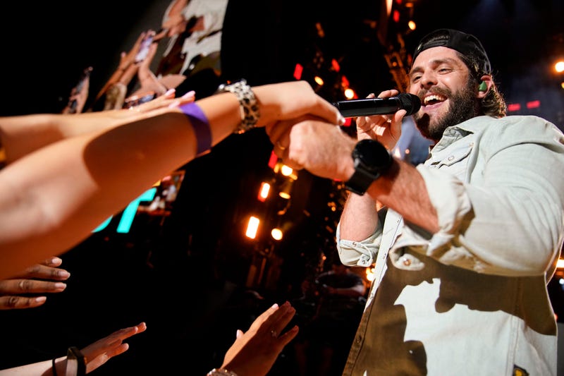 Thomas Rhett interacts with fans as he performs during CMA Fest at Nissan Stadium