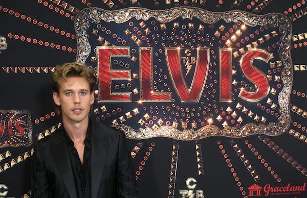Austin Butler greets the press during a red carpet event before the screening for the new biopic movie 'Elvis' at Graceland