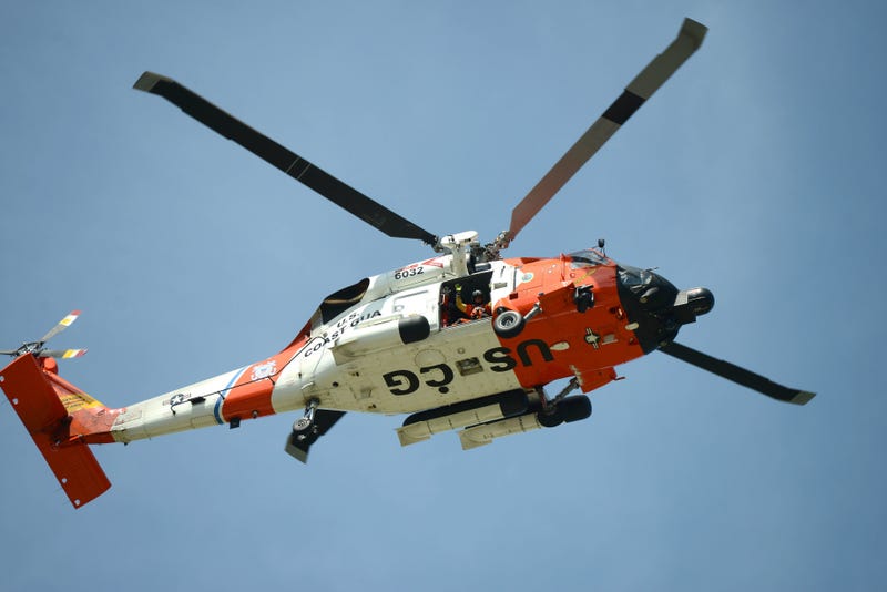 Coast Guard members in the air and on the water worked save three people in the Detroit River last night after a boater's vessel caught fire.