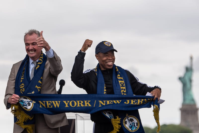 Gov. Phil Murphy and Mayor Eric Adams celebrate at Liberty State Park in Jersey City on June 16, 2022, after FIFA announced the 2026 World Cup host cities