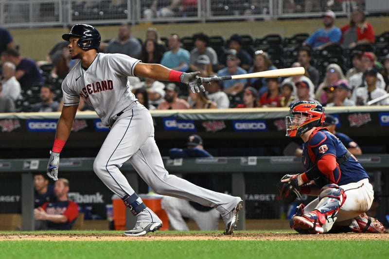 Cleveland Guardians outfielder Oscar Gonzalez (39) drives in two runs on a single against the Minnesota Twins during the ninth inning at Target Field.