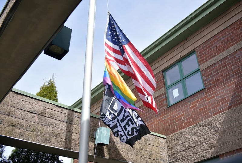 american, price and blm flags