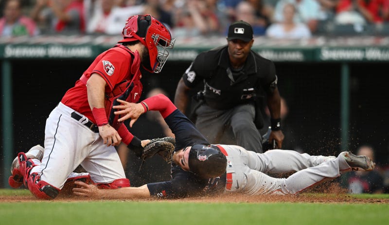 Cleveland Guardians catcher Austin Hedges (17) tags out Boston Red Sox shortstop Christian Arroyo (39) during the fifth inning at Progressive Field. 
