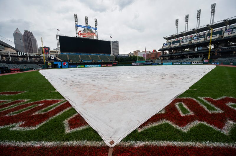 The tarp covers the infield as the game between the Cleveland Guardians and the Detroit Tigers is postponed at Progressive Field. 