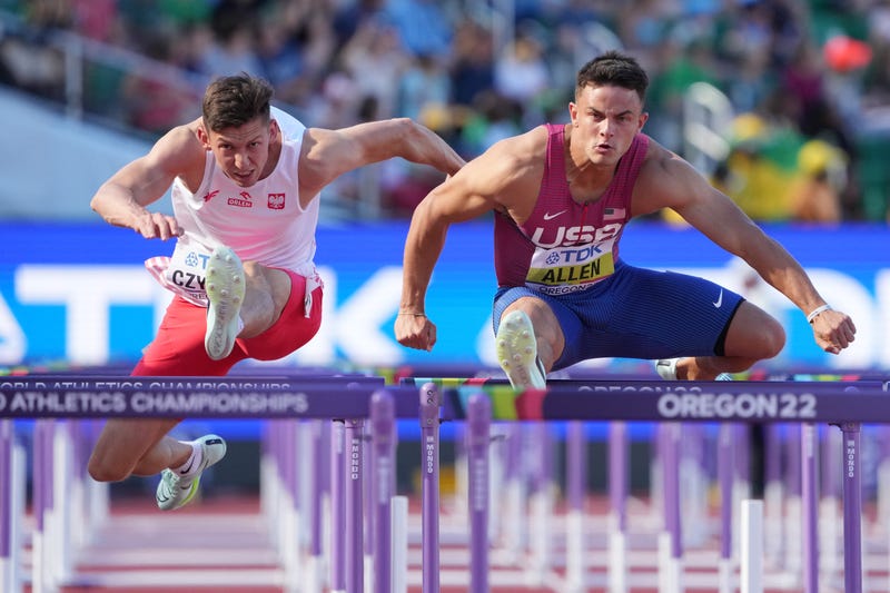 From left: Damian Czykier (POL) and Devon Allen (USA) compete in a qualifying heat of the men's 110-meter hurdles semifinals during the World Athletics Championships at Hayward Field in Eugene, Oregon, on July 17, 2022.