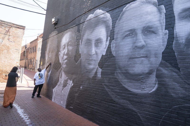 Paul Whelan appears on a mural honoring 18 wrongfully detained Americans
