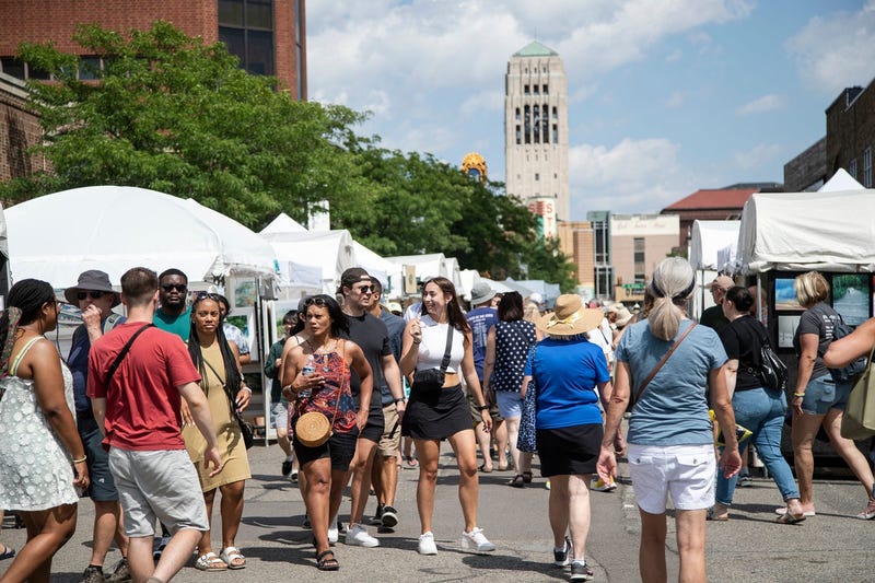 Art lovers walk along South Main Street during the 2022 Ann Arbor Art Fair in Ann Arbor on Thurs., July 21, 2022. The annual Art Fair is held from Thursday to Saturday with nearly 1,000 artists displaying their work over 30 city blocks.