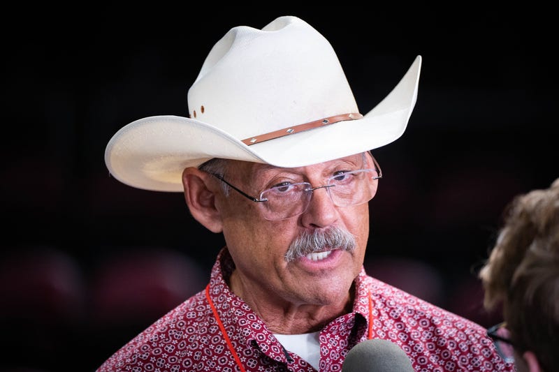Mark Finchem gives an interview to the media during former President Donald Trump's Save America rally at the Findlay Toyota Center in Prescott Valley on July 22, 2022.