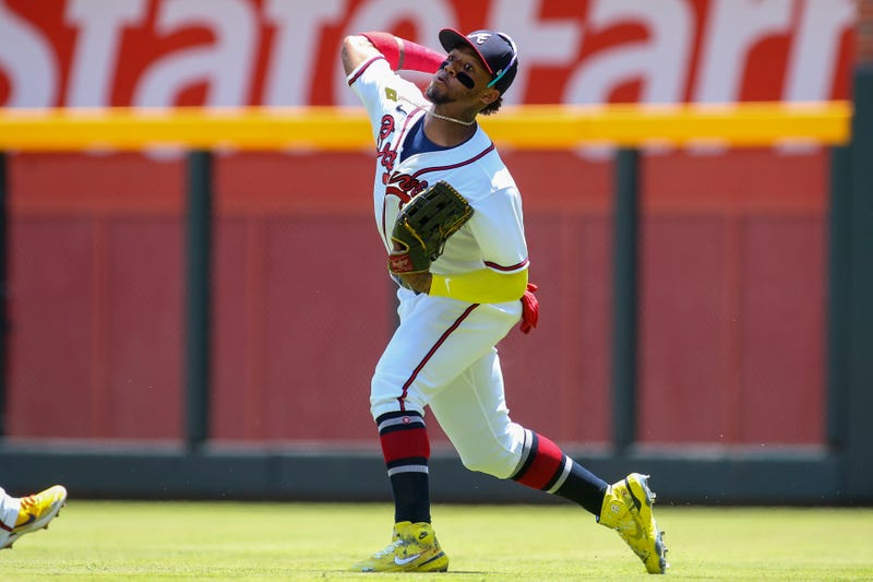 Jul 24, 2022; Atlanta, Georgia, USA; Atlanta Braves right fielder Ronald Acuna Jr. (13) throws the ball in against the Los Angeles Angels in the first inning at Truist Park.