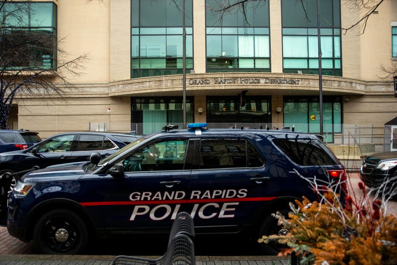 One man is dead and three police officers are on administrative leave after a mid-day shootout broke out between cops and a murder suspect in West Michigan on Thursday.