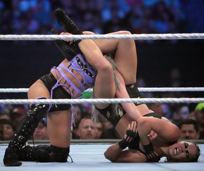 Ronda Rousey (right) and Liv Morgan battle for the SmackDown Women's Championship at SummerSlam 2022 in Nashville, Tennessee.
