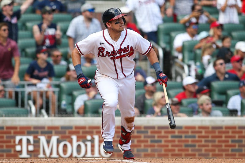 Jul 31, 2022; Atlanta, Georgia, USA; Atlanta Braves third baseman Austin Riley (27) hits a game-winning RBI double against the Arizona Diamondbacks in the ninth inning at Truist Park. 