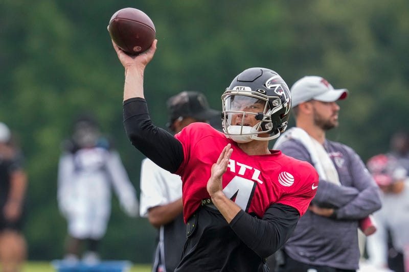 Aug 1, 2022; Flowery Branch, GA, USA; Atlanta Falcons quarterback Desmond Ridder (4) passes during training camp at IBM Performance Field. 