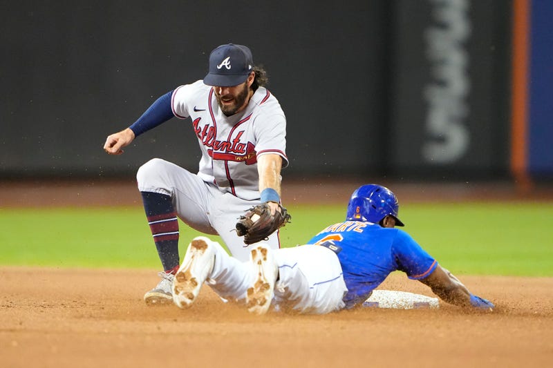 Aug 6, 2022; New York City, New York, USA; New York Mets right fielder Starling Marte (6) steals second base with Atlanta Braves shortstop Dansby Swanson (7) receiving the throw during the seventh inning at Citi Field. 