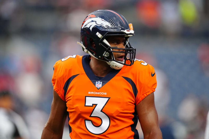 Russell Wilson models the orange crush Broncos uniforms. 