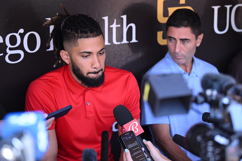 Fernando Tatis Jr. (left) speak to the media alongside general manager A.J. Preller (right) 