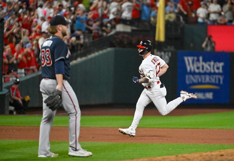 Aug 28, 2022; St. Louis, Missouri, USA; St. Louis Cardinals left fielder Tyler O'Neill (27) runs the bases after hitting a go ahead three run home run off of Atlanta Braves relief pitcher A.J. Minter (33) during the eighth inning at Busch Stadium. 
