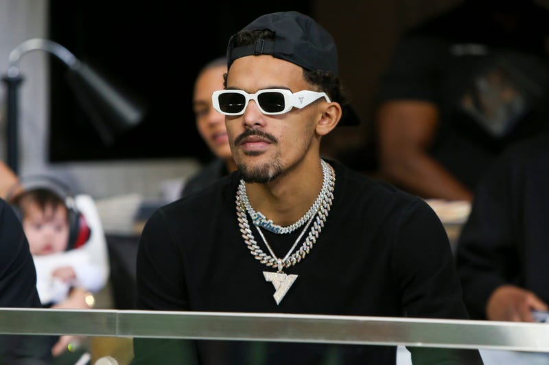 Sep 11, 2022; Atlanta, Georgia, USA; Atlanta Hawks guard Trae Young (11) sits in a suite before a game between the Atlanta Falcons and New Orleans Saints at Mercedes-Benz Stadium. 