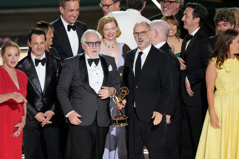Brian Cox (center left) and Jesse Armstrong (center right) accept the award for outstanding drama series for the HBO program Succession along with cast and crew during the 74th Emmy Awards at the Microsoft Theater in Los Angeles on Sept. 12, 2022.