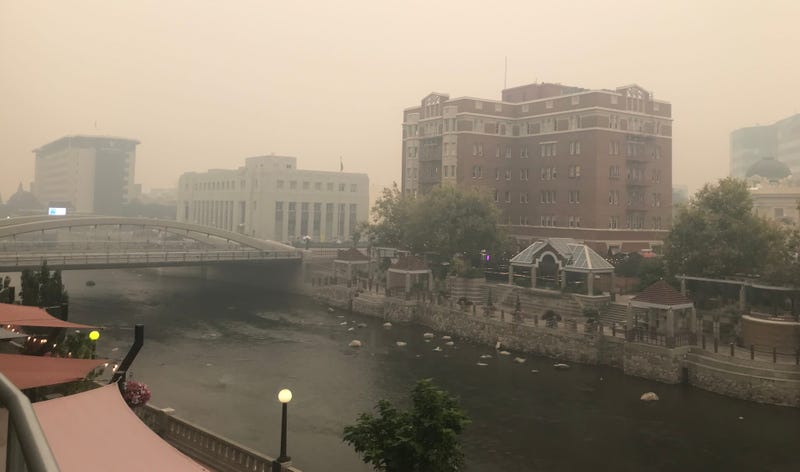 Heavy smoke from the Mosquito Fire in Northern California thickened over downtown Reno's Riverwalk on Monday afternoon, Sept. 12, 2022