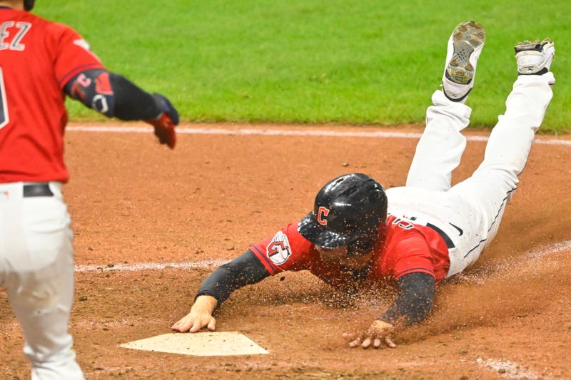 Cleveland Guardians pinch runner Ernie Clement (28) scores from second base on a wild pitch in the eighth inning against the Minnesota Twins at Progressive Field. 