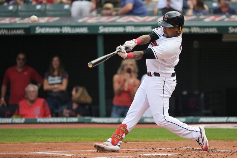 Cleveland Guardians third baseman Jose Ramirez (11) hits a home run during the first inning against the Minnesota Twins at Progressive Field.