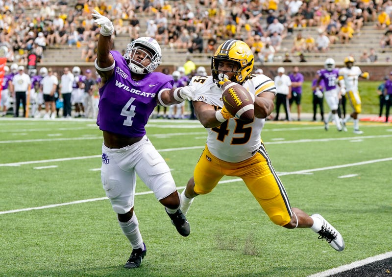 Abilene Christian Wildcats defensive back Anthony Egbo Jr. (4) defends a pass against Missouri Tigers tight end Kibet Chepyator (45) during the second half at Faurot Field at Memorial Stadium.