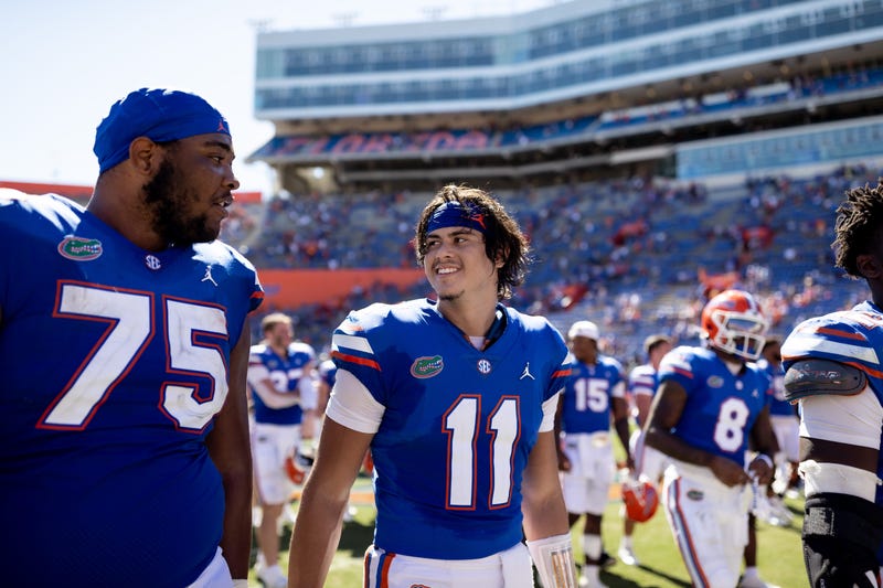 Florida Gators quarterback Jalen Kitna (11) smiles at Florida Gators offensive lineman Kamryn Waites (75) after the game against the Eastern Washington Eagles at Steve Spurrier Field at Ben Hill Griffin Stadium in Gainesville, FL on Sunday, October 2, 2022. [Matt Pendleton/Gainesville Sun] Ncaa Football Florida Gators Vs Eastern Washington Eagles