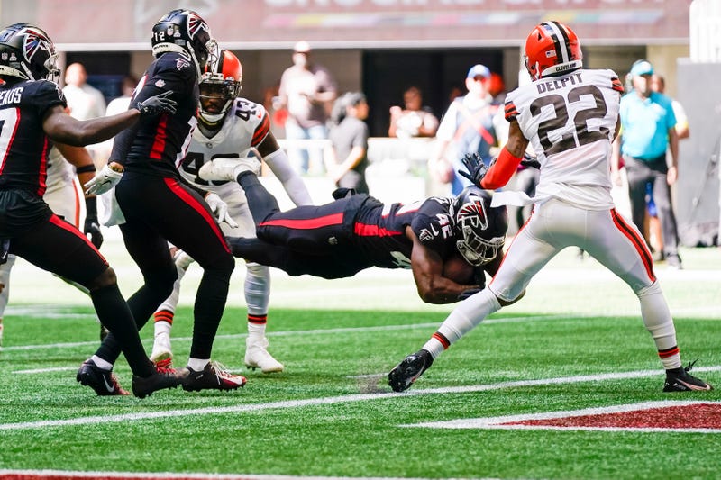 Oct 2, 2022; Atlanta, Georgia, USA; Atlanta Falcons running back Caleb Huntley (42) scores a touchdown against the Cleveland Browns during the second half at Mercedes-Benz Stadium. 