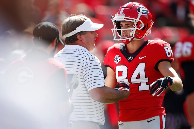 Georgia coach Kirby Smart speaks with Georgia Bulldogs wide receiver Ladd McConkey