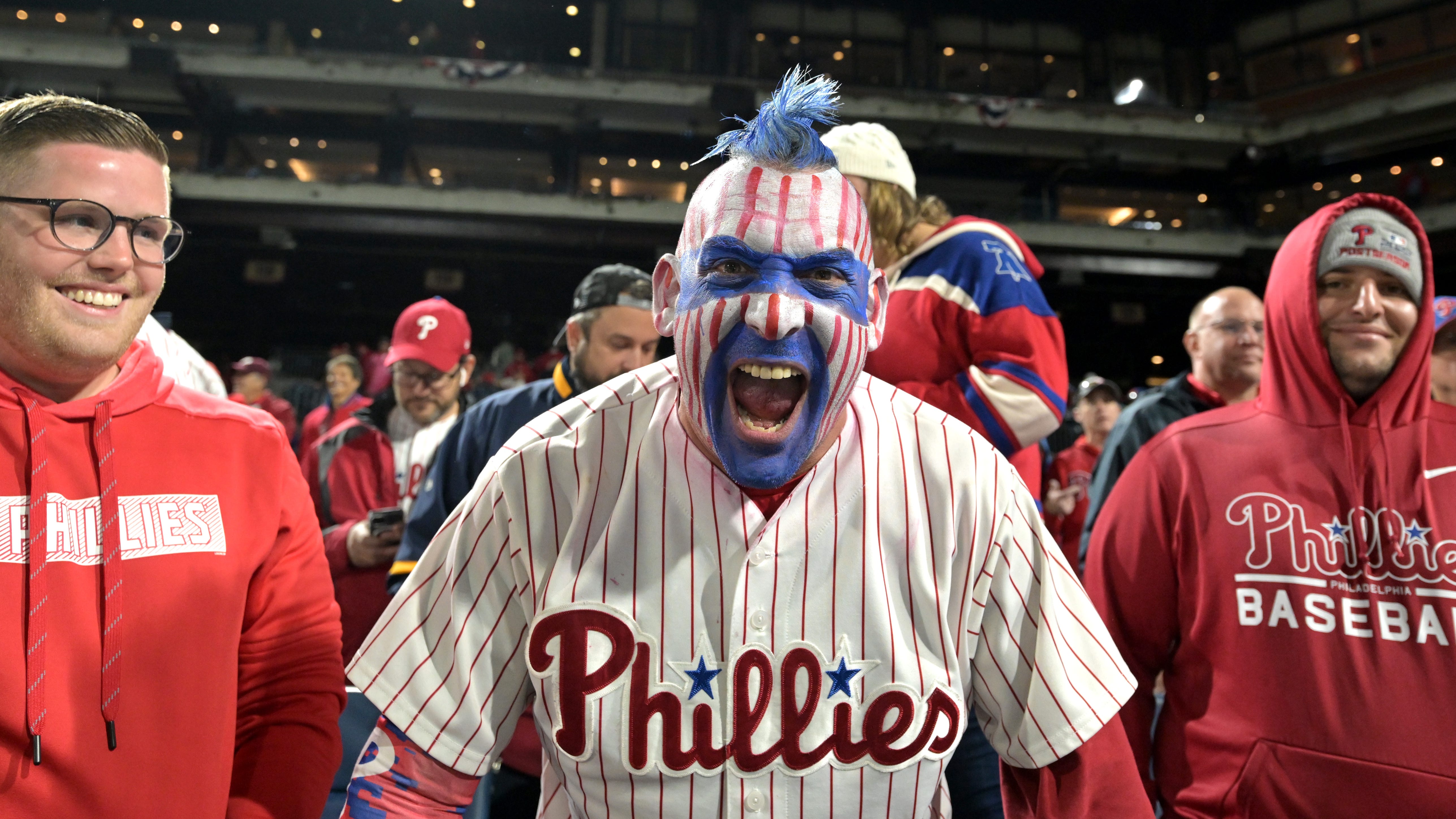 Climbing city poles and pickup baseball games: Highlights of Philadelphia celebrating Phillies pennant