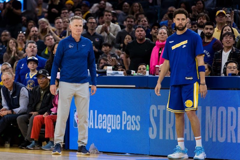 Oct 21, 2022; San Francisco, California, USA; Golden State Warriors head coach Steve Kerr and guard Klay Thompson (11) watch during the second half of the game against the Denver Nuggets at Chase Center. 