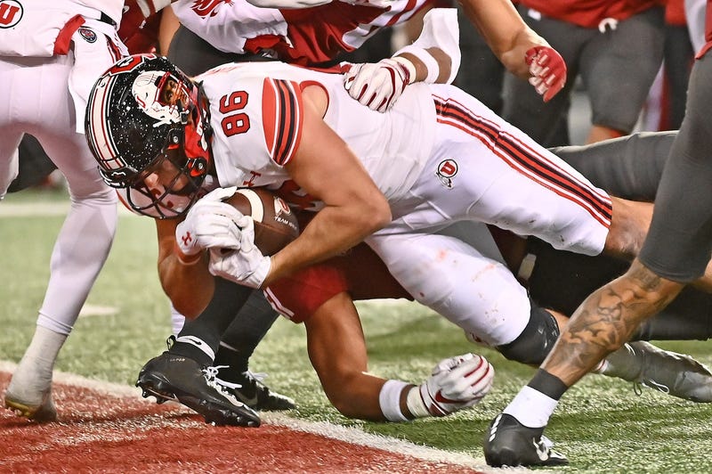 Utah Utes tight end Dalton Kincaid (86) carries the ball in for a touchdown against Washington State Cougars linebacker Francisco Mauigoa (51) in the second half at Gesa Field at Martin Stadium. Utah won 21-17.