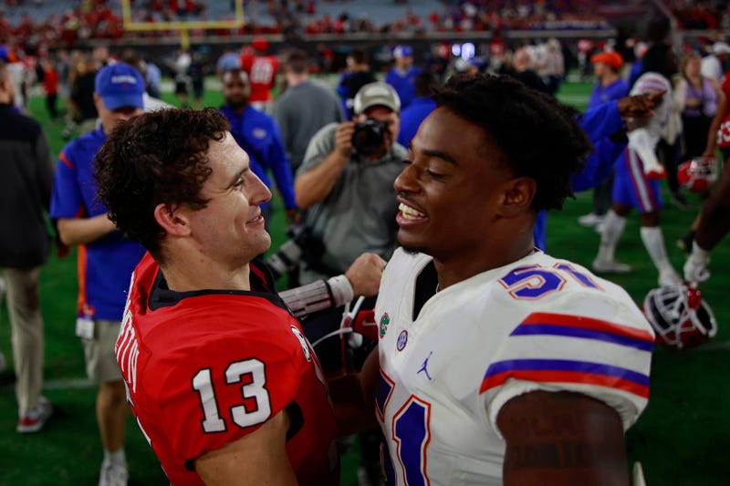 Georgia Bulldogs quarterback Stetson Bennett (13) greets Florida Gators linebacker Ventrell Miller (51) after a NCAA football game Saturday, Oct. 29, 2022 at TIAA Bank Field in Jacksonville.The Georgia Bulldogs held off the Florida Gators 42-20. [Corey Perrine/Florida Times-Union] Flgai 102922 Florida Vs Georgia 115