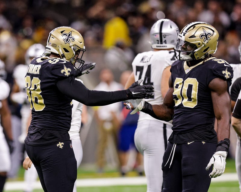 Payton Turner and Tanoh Kpassagnon celebrate during a win over the Raiders. 