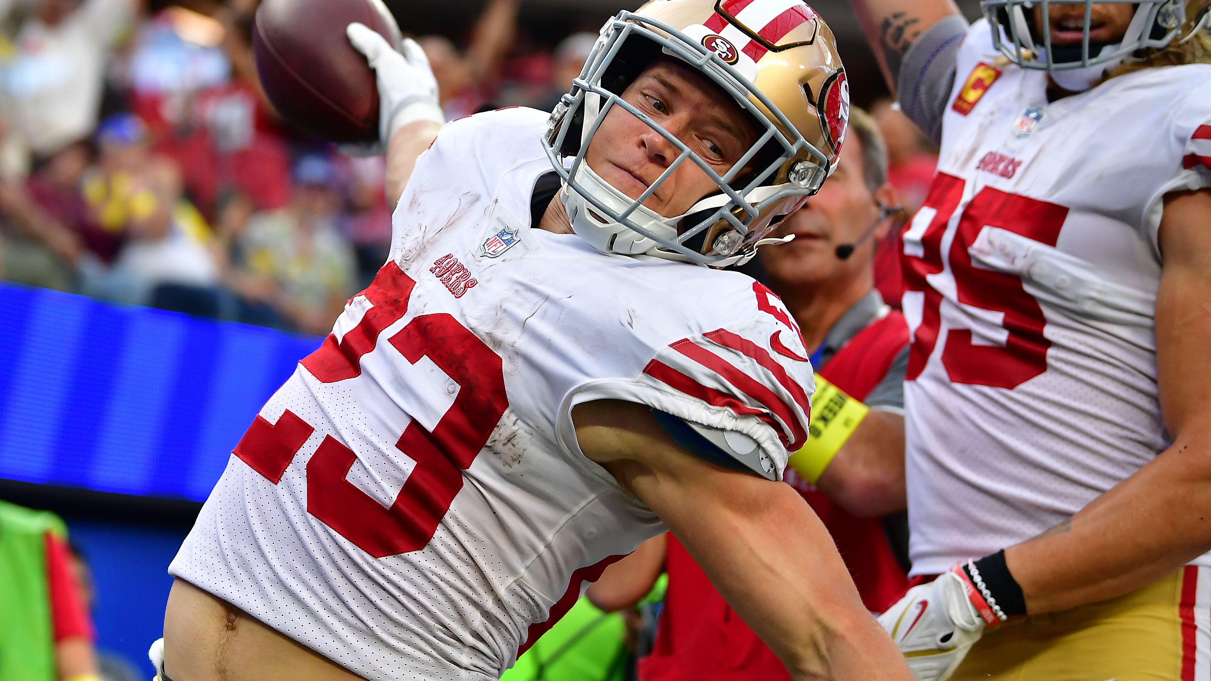 Where does Christian McCaffrey's three-touchdown game rank in 49ers history?