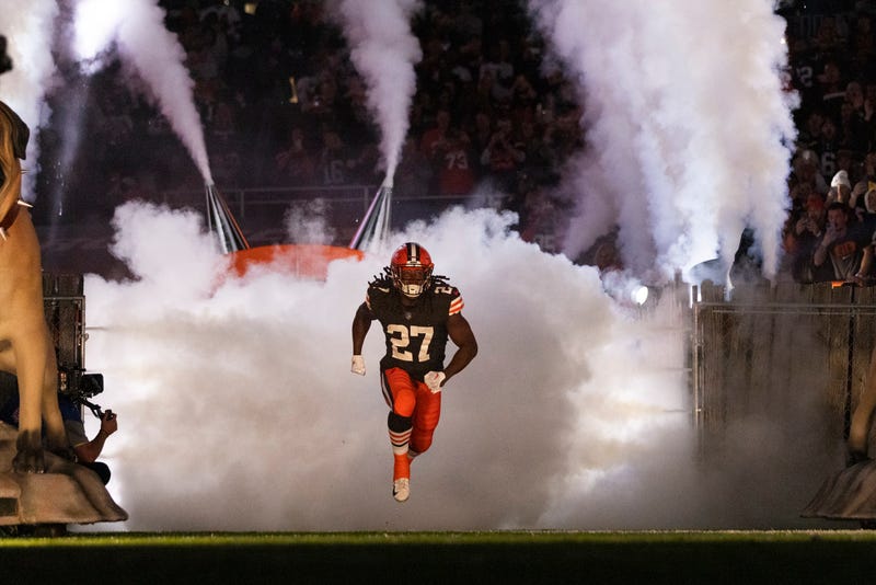 Kareem Hunt (27) runs onto the field for player introductions before the game against the Cincinnati Bengals at FirstEnergy Stadium.