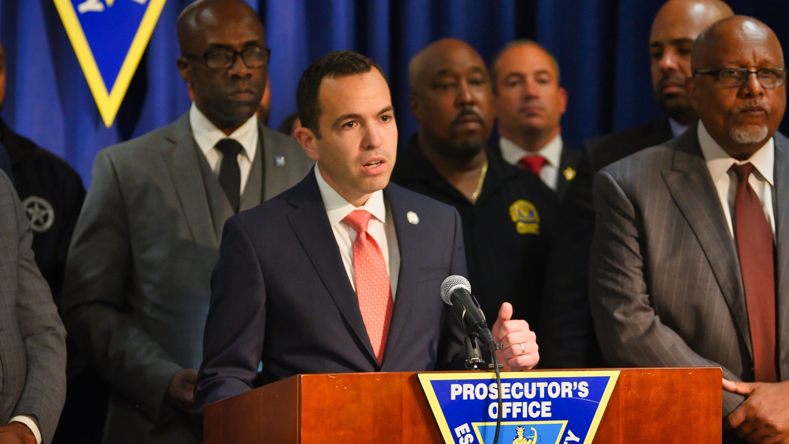 NJ charges Paterson officer who shot, wounded fleeing person